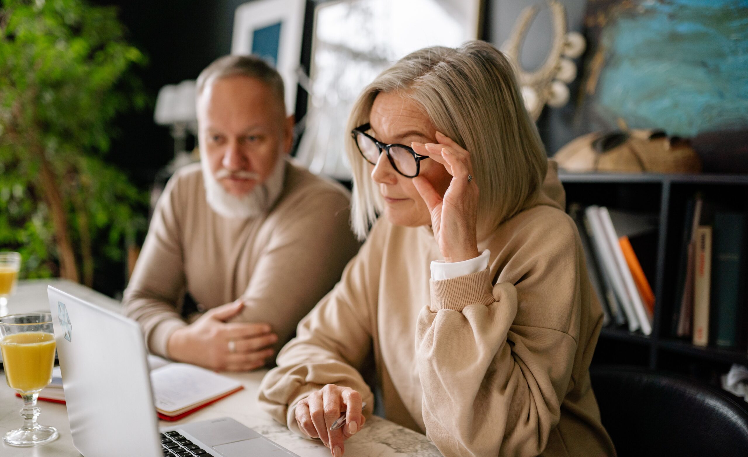 Elderly couple looking at laptop