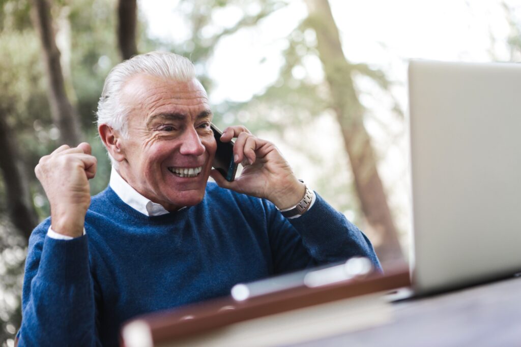 Elderly man smiling and cheering.jpg